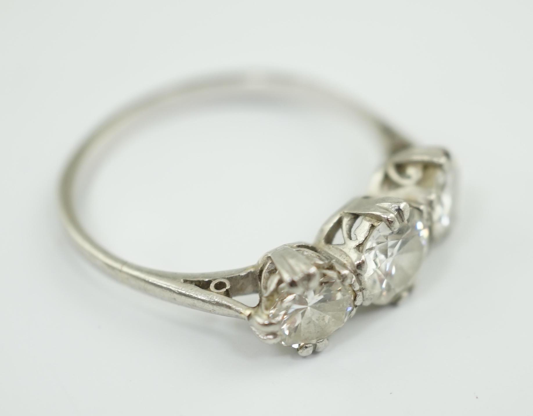 A platinum? and three stone diamond set ring